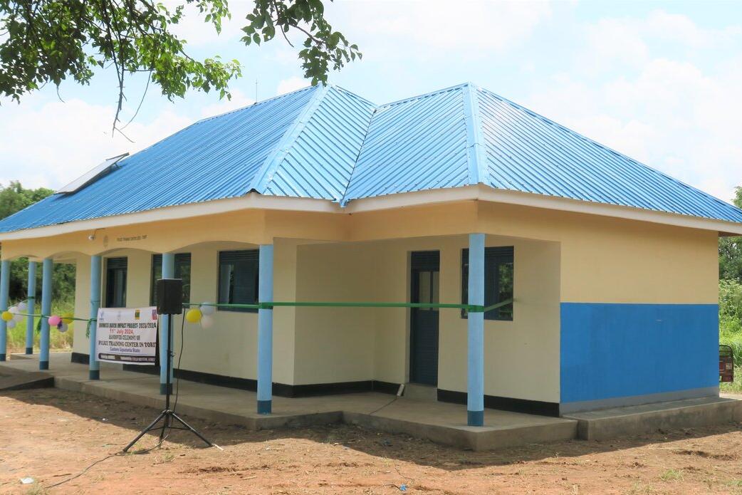 A yellow building with a blue roof