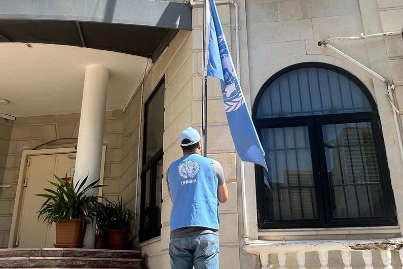 UNMHA The United Nations flag is lowered at a UN building in Yemen.