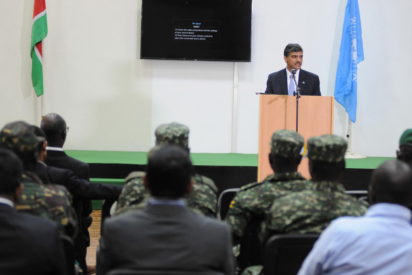 A man stands at a podium